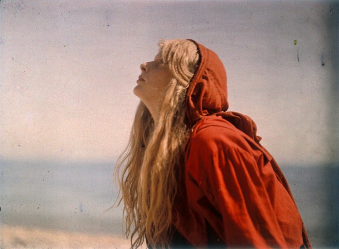 Portrait of Christina wearing a red cloak c.1913. Autochrome by Lieutenant Colonel Mervyn O’Gorman © Royal Photographic Society/ National Media Museum