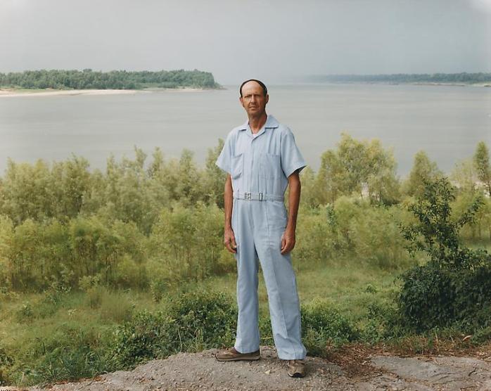 Joel Sternfeld, A Man on the Banks of the Mississippi, Baton Rouge, Louisiana, August 1985, From Stranger Passing - © Joel Sternfeld