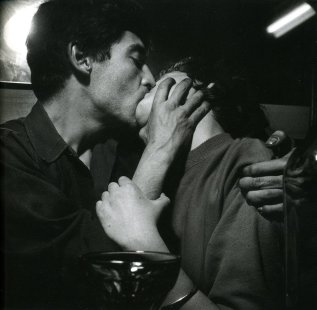 “Pierre Feuillette and Paulette Vielhomme kissing at café Chez Moineau, Paris,” 1953. Nederlands Fotomuseum / © Ed van der Elsken / Collection Ed van der Elsken estate